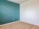 Bedroom with teal and white walls, tan carpet at 460 Boardwalk Ave, Haines City, FL 33844