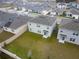 Aerial view of houses in a community, showcasing backyard spaces at 460 Boardwalk Ave, Haines City, FL 33844