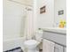 Bathroom with gray vanity and shower/tub combo at 460 Boardwalk Ave, Haines City, FL 33844