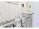Clean bathroom with grey vanity and shower/tub combo at 460 Boardwalk Ave, Haines City, FL 33844