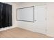 Bedroom with projector screen and neutral decor at 460 Boardwalk Ave, Haines City, FL 33844