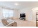 Relaxing living room with reclining sofa and large window at 460 Boardwalk Ave, Haines City, FL 33844
