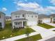 Two-story house with gray siding and a two-car garage at 460 Boardwalk Ave, Haines City, FL 33844