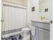 Clean bathroom with gray vanity and shower/tub combo at 460 Boardwalk Ave, Haines City, FL 33844