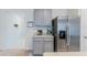 Kitchen area with stainless steel refrigerator at 460 Boardwalk Ave, Haines City, FL 33844