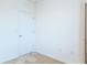 Empty bedroom with white walls and tan carpet at 460 Boardwalk Ave, Haines City, FL 33844