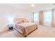 Spacious main bedroom with large bed, nightstands, and plenty of natural light at 460 Boardwalk Ave, Haines City, FL 33844