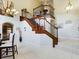 Impressive two-story staircase with open railing at 5219 Mystic Point Ct, Orlando, FL 32812