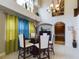 Bright dining room with a glass-top table and modern chairs at 5219 Mystic Point Ct, Orlando, FL 32812