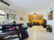 Gathering room with leather sectional and an accent wall at 5219 Mystic Point Ct, Orlando, FL 32812