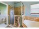 Large bathroom with walk-in shower and corner tub at 5219 Mystic Point Ct, Orlando, FL 32812