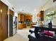 Modern kitchen featuring wood cabinets and stainless steel appliances at 5219 Mystic Point Ct, Orlando, FL 32812