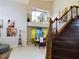Elegant staircase with dark wood and wrought iron accents at 5219 Mystic Point Ct, Orlando, FL 32812