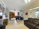 Open floor plan connecting living room and kitchen with island at 5219 Mystic Point Ct, Orlando, FL 32812