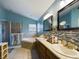 Spa-like bathroom with double vanity and corner tub at 5219 Mystic Point Ct, Orlando, FL 32812