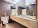 Bathroom with double vanity, toilet and shower/tub combo at 2741 Edwards Rd, Haines City, FL 33844