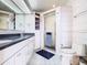 Bathroom boasts a large vanity, shower, and toilet at 2741 Edwards Rd, Haines City, FL 33844