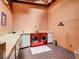 Convenient laundry room with red washer and dryer at 2741 Edwards Rd, Haines City, FL 33844