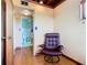 Relaxing bedroom with a leather armchair and bathroom access at 2741 Edwards Rd, Haines City, FL 33844