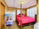 Bedroom with a pink bedspread, a bed, and a canopy at 2741 Edwards Rd, Haines City, FL 33844