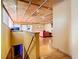 Hallway view of living room with hardwood floors and exposed beams at 2741 Edwards Rd, Haines City, FL 33844