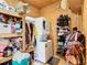 Laundry room with washer, dryer, shelving, and shoe storage at 2741 Edwards Rd, Haines City, FL 33844