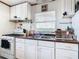 Clean and functional kitchen with white cabinets and wood countertops at 2741 Edwards Rd, Haines City, FL 33844