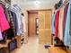Spacious walk-in closet with ample hanging space and shelving at 2741 Edwards Rd, Haines City, FL 33844