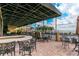 Lake Ashton community patio with tables, chairs, and bar at 4432 Waterford Dr, Lake Wales, FL 33859