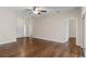 Living room with hardwood floors, ceiling fan and access to other rooms at 4432 Waterford Dr, Lake Wales, FL 33859