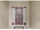 Dark brown front door with sidelights and a small welcome mat at 4432 Waterford Dr, Lake Wales, FL 33859