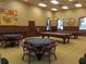 Game room featuring pool table, card tables, and comfortable seating at 4432 Waterford Dr, Lake Wales, FL 33859