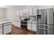 Kitchen with stainless steel appliances and white cabinets at 4432 Waterford Dr, Lake Wales, FL 33859
