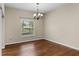 Spacious dining area with wood floors and a chandelier at 4432 Waterford Dr, Lake Wales, FL 33859