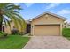 House exterior featuring a two car garage and brick driveway at 4432 Waterford Dr, Lake Wales, FL 33859