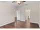 Bedroom with wood floors, ceiling fan, and en-suite bathroom access at 4432 Waterford Dr, Lake Wales, FL 33859