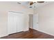Bright bedroom with double door closet and wood-look flooring at 4432 Waterford Dr, Lake Wales, FL 33859
