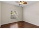 Spacious bedroom with wood floors and a window at 4432 Waterford Dr, Lake Wales, FL 33859