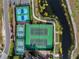 Aerial of tennis and pickleball courts near a lake at 4432 Waterford Dr, Lake Wales, FL 33859