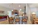 Modern kitchen with breakfast bar and stylish pendant lighting at 1067 Snively Cir, Lake Hamilton, FL 33851