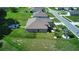 Aerial view of a house with a backyard at 1067 Snively Cir, Lake Hamilton, FL 33851