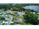 Aerial view showing a house near a lake and other homes at 1067 Snively Cir, Lake Hamilton, FL 33851
