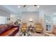 Comfortable living room with leather furniture and hardwood floors at 1067 Snively Cir, Lake Hamilton, FL 33851