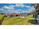 Large backyard with grassy area and fenced perimeter at 1067 Snively Cir, Lake Hamilton, FL 33851
