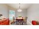 Charming breakfast nook with a table and four chairs near a window at 1067 Snively Cir, Lake Hamilton, FL 33851