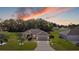 Aerial view of a single-story house with a large front yard and driveway at 1067 Snively Cir, Lake Hamilton, FL 33851