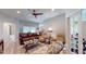 Spacious living room with leather furniture and hardwood floors at 1067 Snively Cir, Lake Hamilton, FL 33851