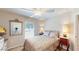 Charming bedroom with full-size bed and mirror at 1067 Snively Cir, Lake Hamilton, FL 33851