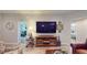Living area showcasing a large TV and comfortable seating at 1067 Snively Cir, Lake Hamilton, FL 33851