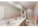 Double vanity bathroom with shower and modern fixtures at 1067 Snively Cir, Lake Hamilton, FL 33851